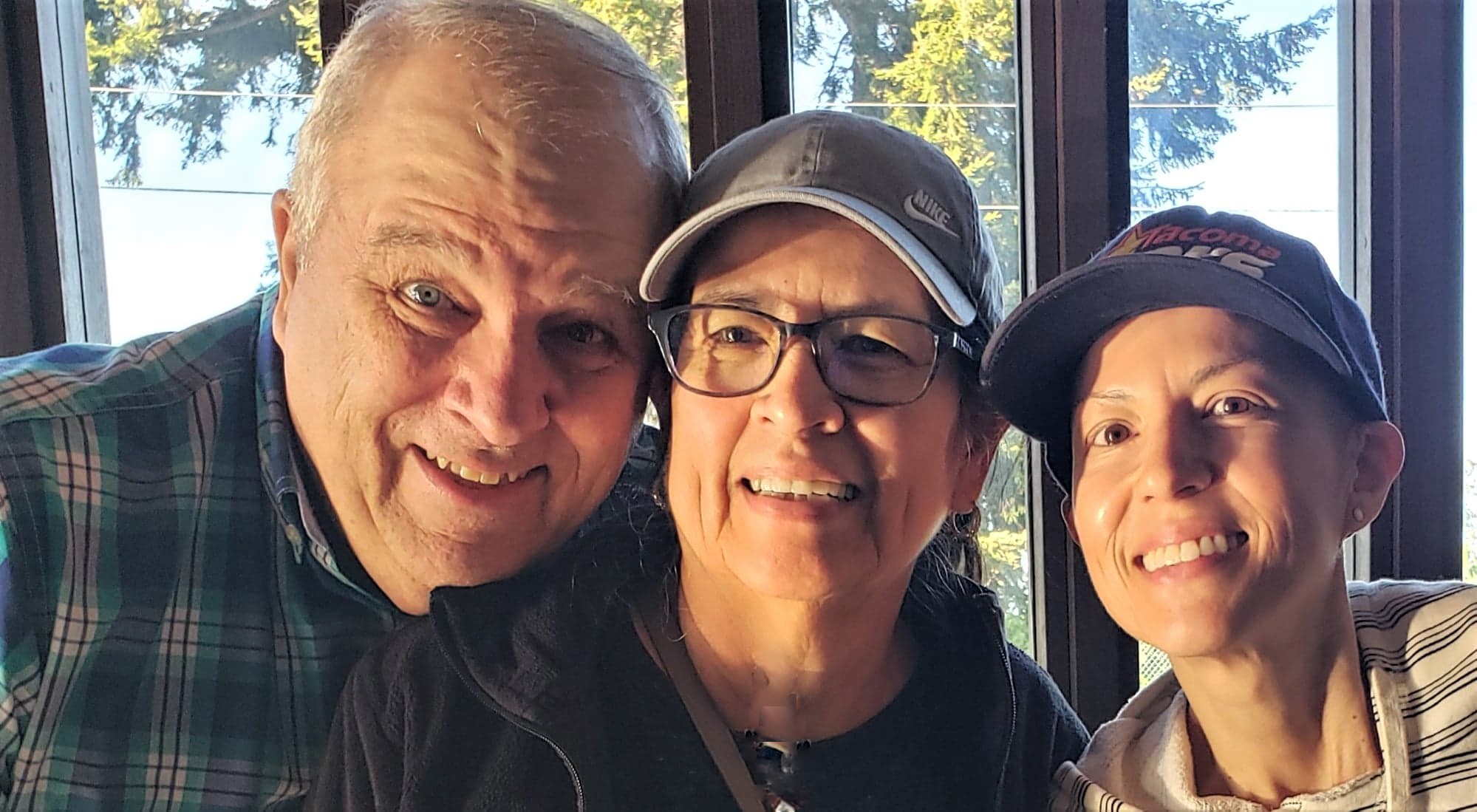 Jennifer Scanlon happily reunited with parents.