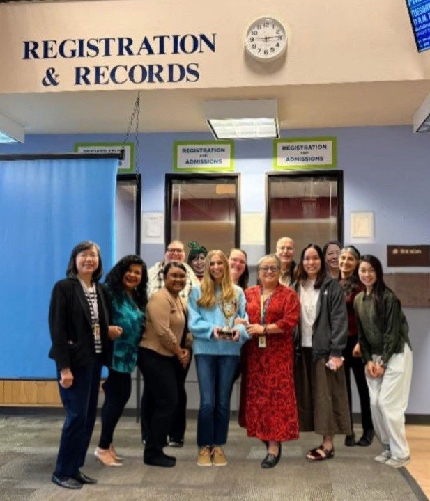 Group photo of Registration & Records, and Admissions Office receiving award